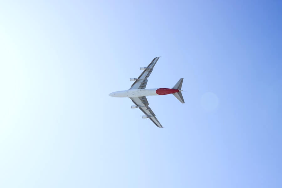 plane in sky on blue-sky background staff nurse to travel nurse