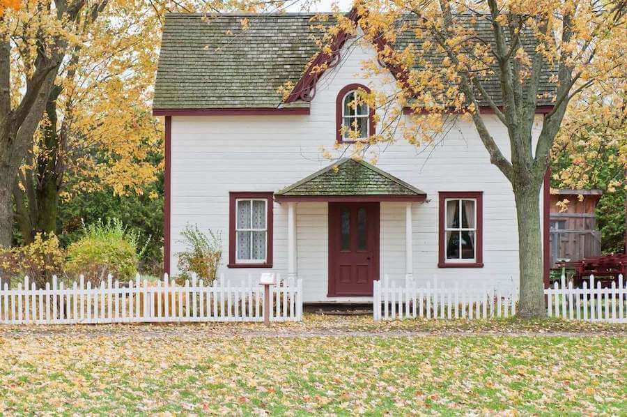 quant country house with small, autumnal front yard travel nurse taxes tax homes