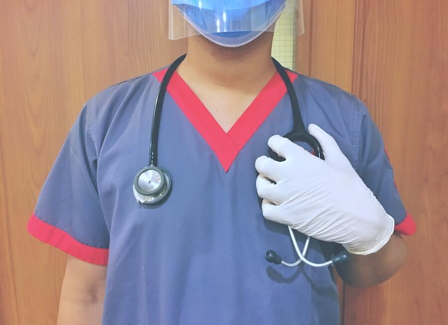 male nurse standing in front of door holding stethoscope what do LPNs do