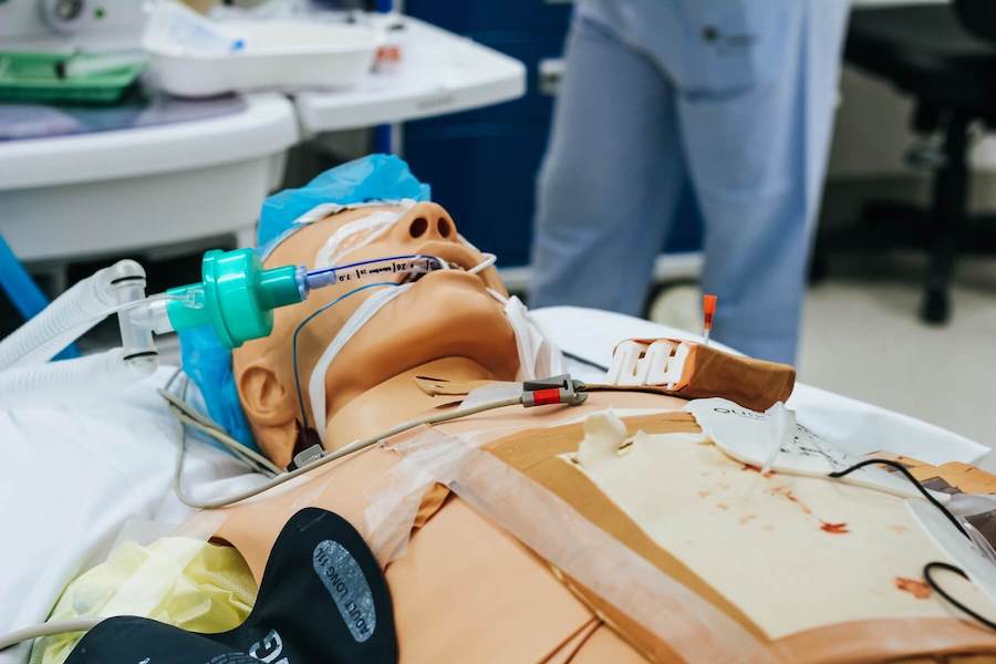 CPR dummy lying on table emergency medicine ER nurse