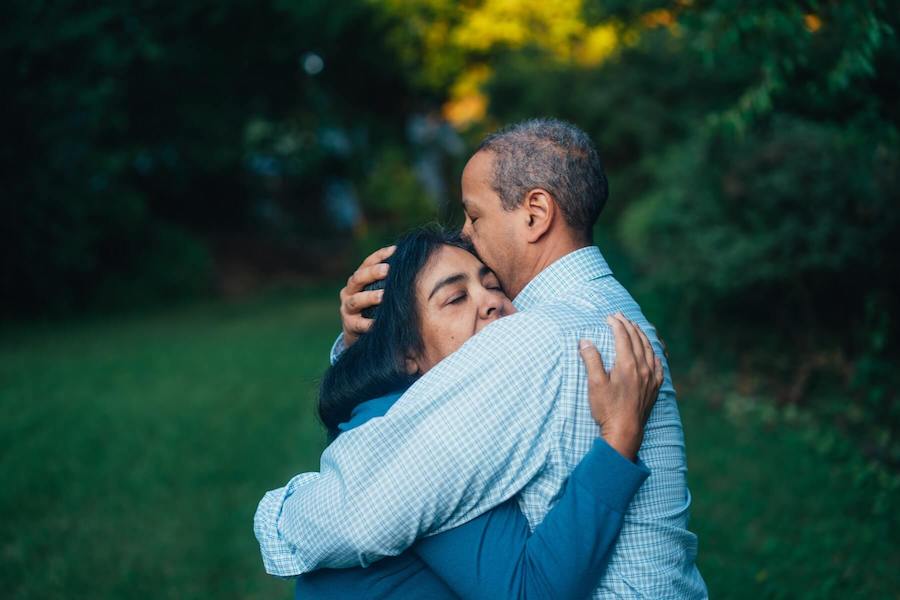 two people hugging cancer surviver oncology nurse