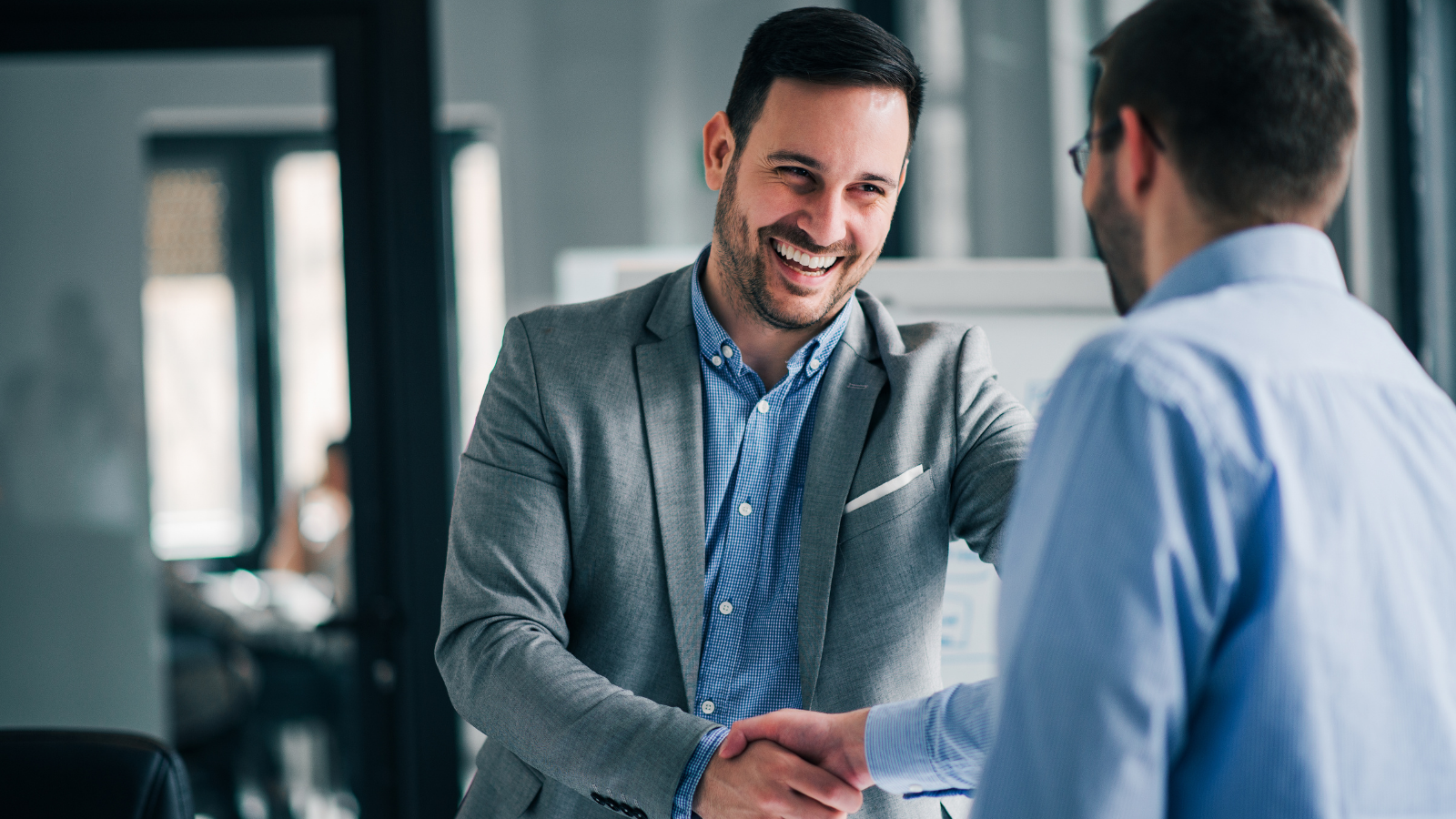 Business professionals agreeing with a handshake