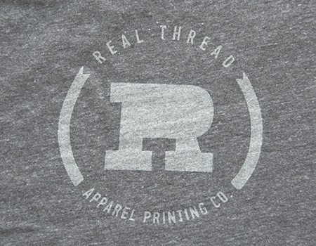 real thread light grey logo on grey shirt