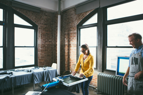 woman in yellow screen printing