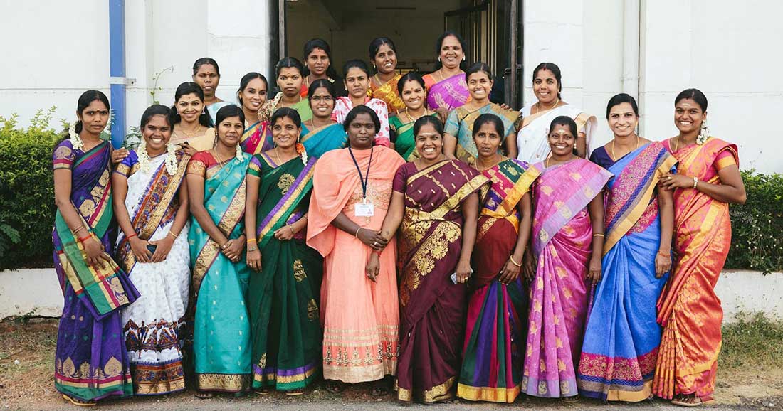 a group of Indian women standing together