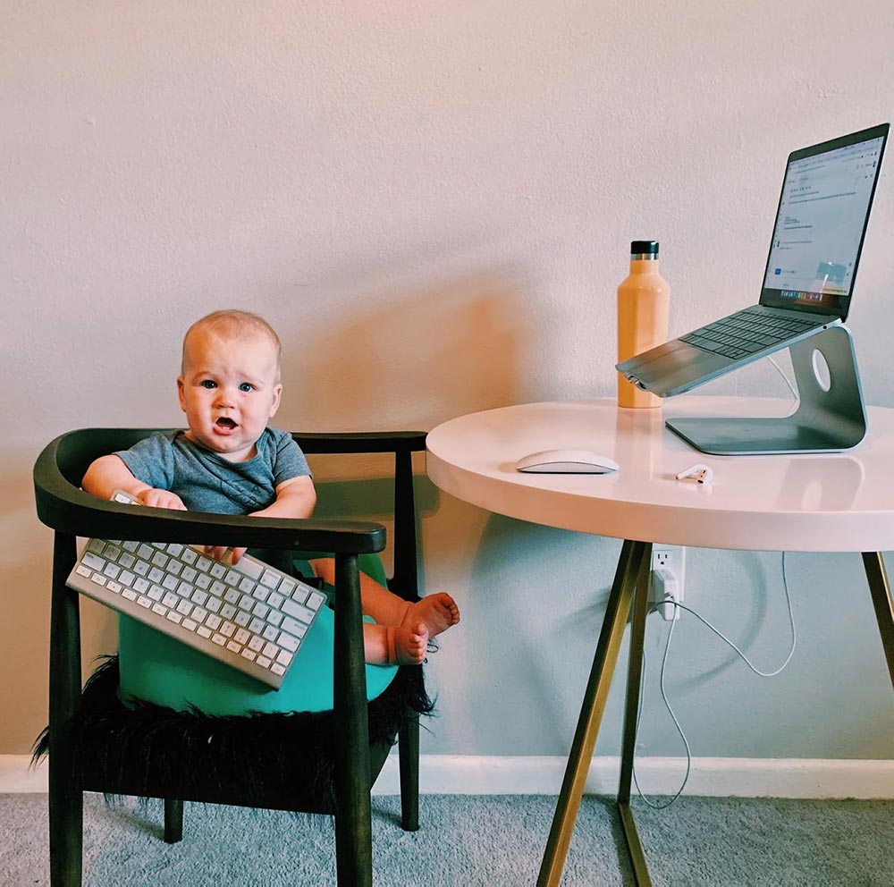 baby on chair with keyboard