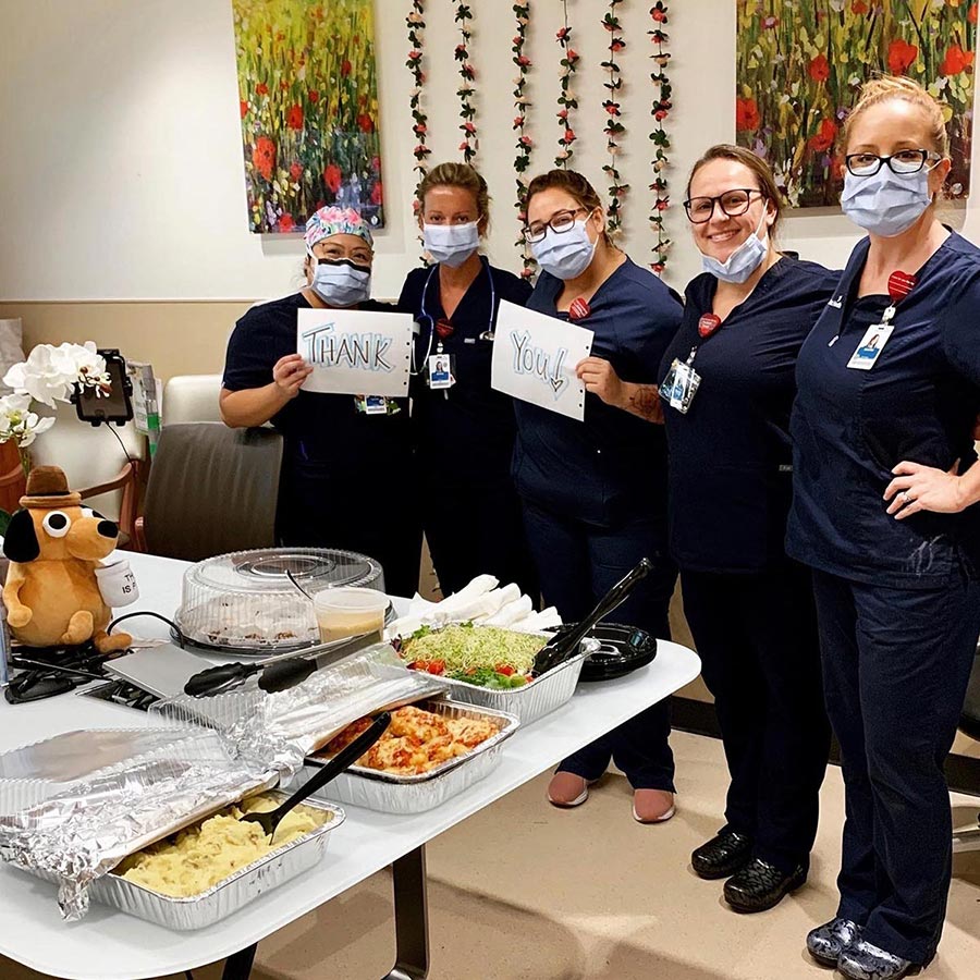 Five nurses standing together