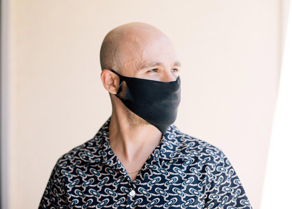 bald man wearing face mask