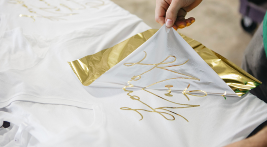 hand pulling gold foil print