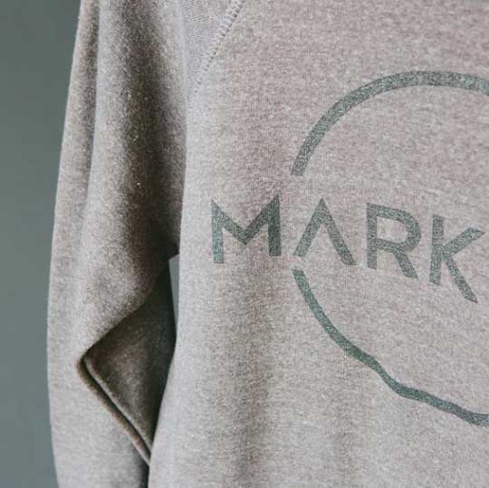 grey sweatshirt with black mark graphic