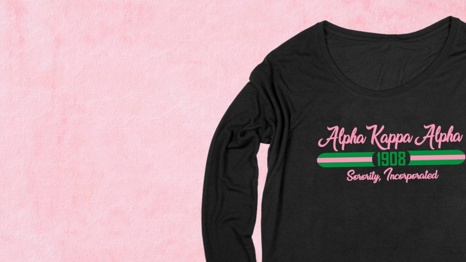 Black sorority long sleeve t-shirt with pink and green text on a pink background