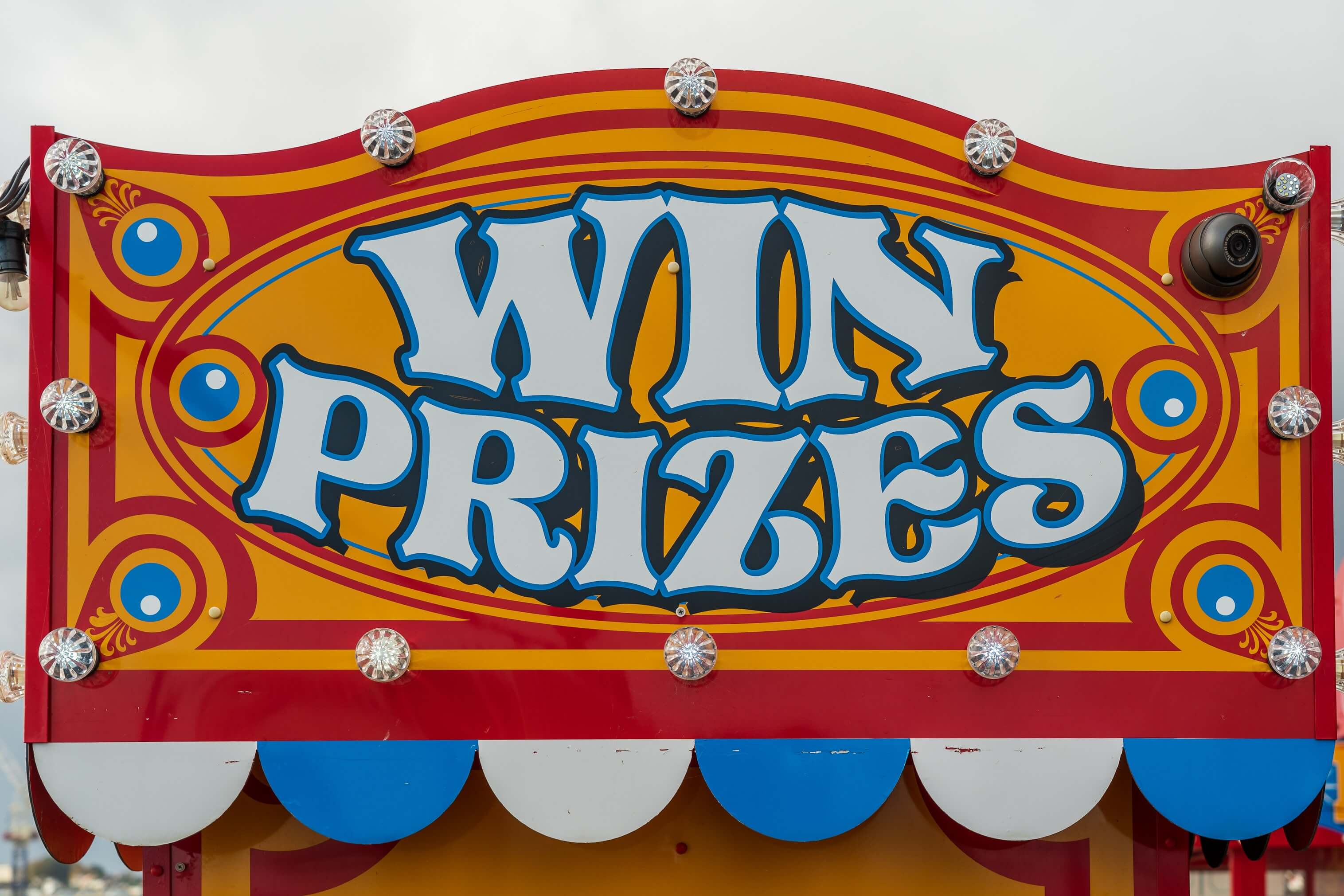 Win prizes sign at carnival