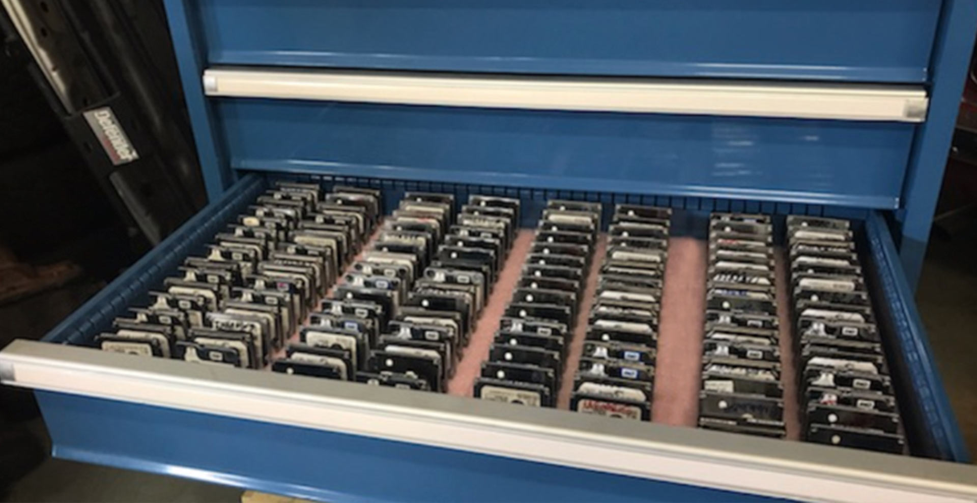 Image of man opening a server rack