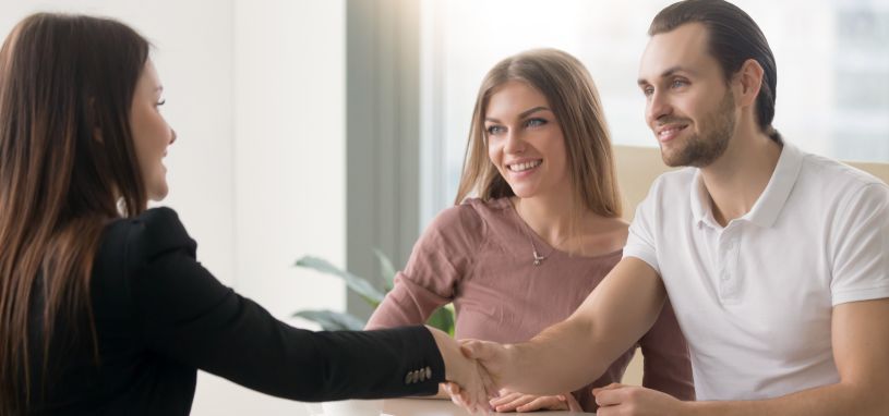 a young couple having a meeting with a property manager
