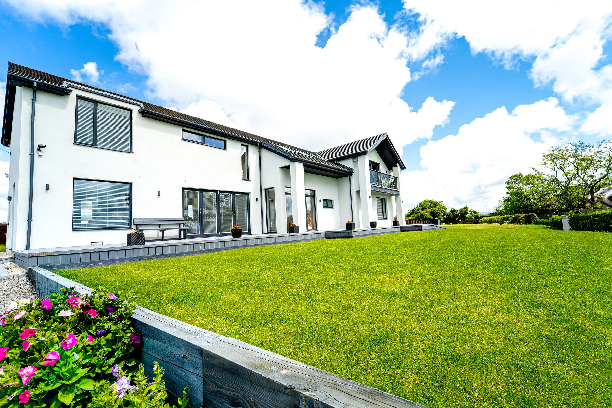 Contemporary Lake District home with white render and anthracite windows designed by WK Design Architects