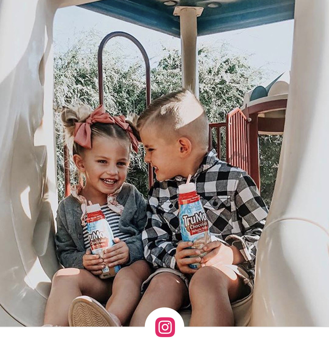 boy and girl holding trumoo milk