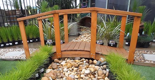 Landscaping showcase with bridge and pebbles
