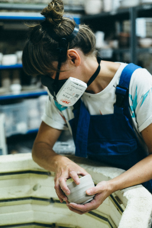 Natalie Smith loading the kiln. Photo: Paul Fuller