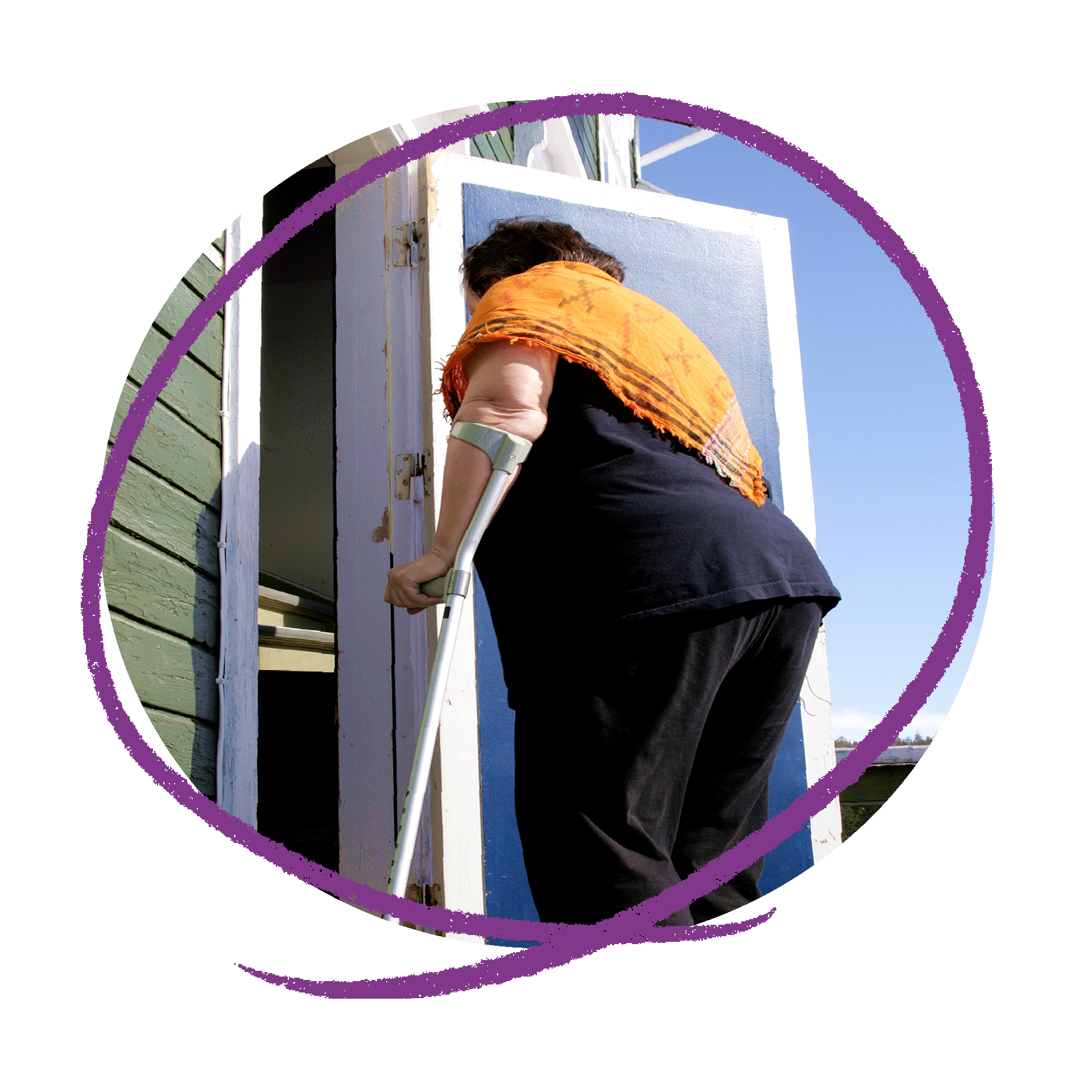 Photo of a woman with a walking stick walking in a door.