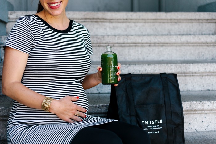 pregnant woman drinking thistle juice