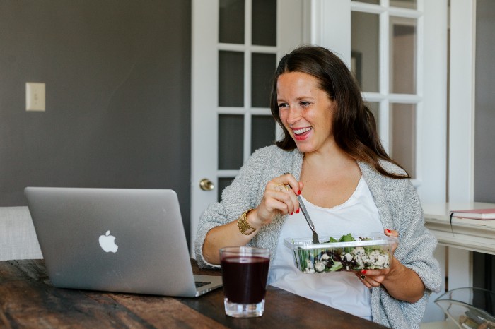 pregnant woman eating salad