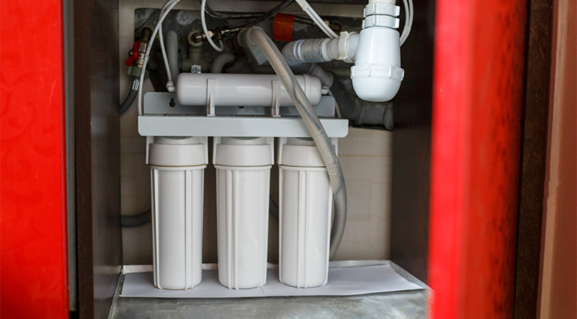 water filtration system in cabinet