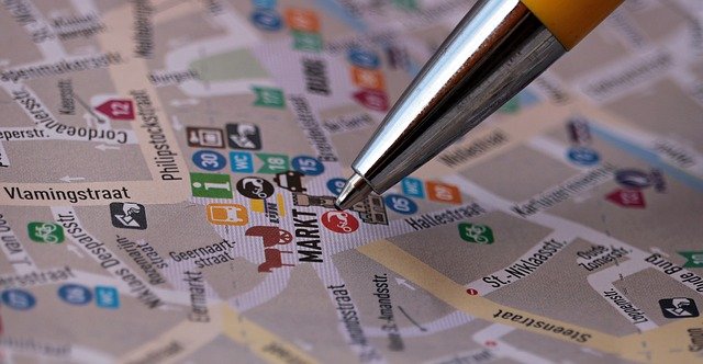 Pen pointing at a specific location on a map