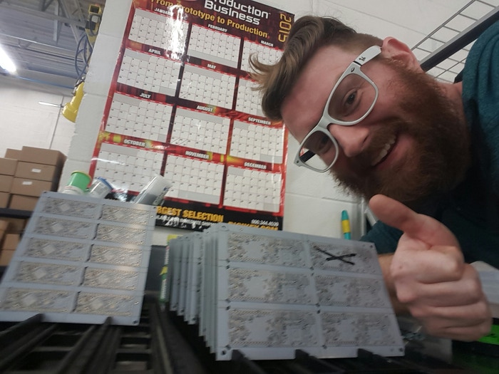 Daniel with some boards ready to go through SMT processing