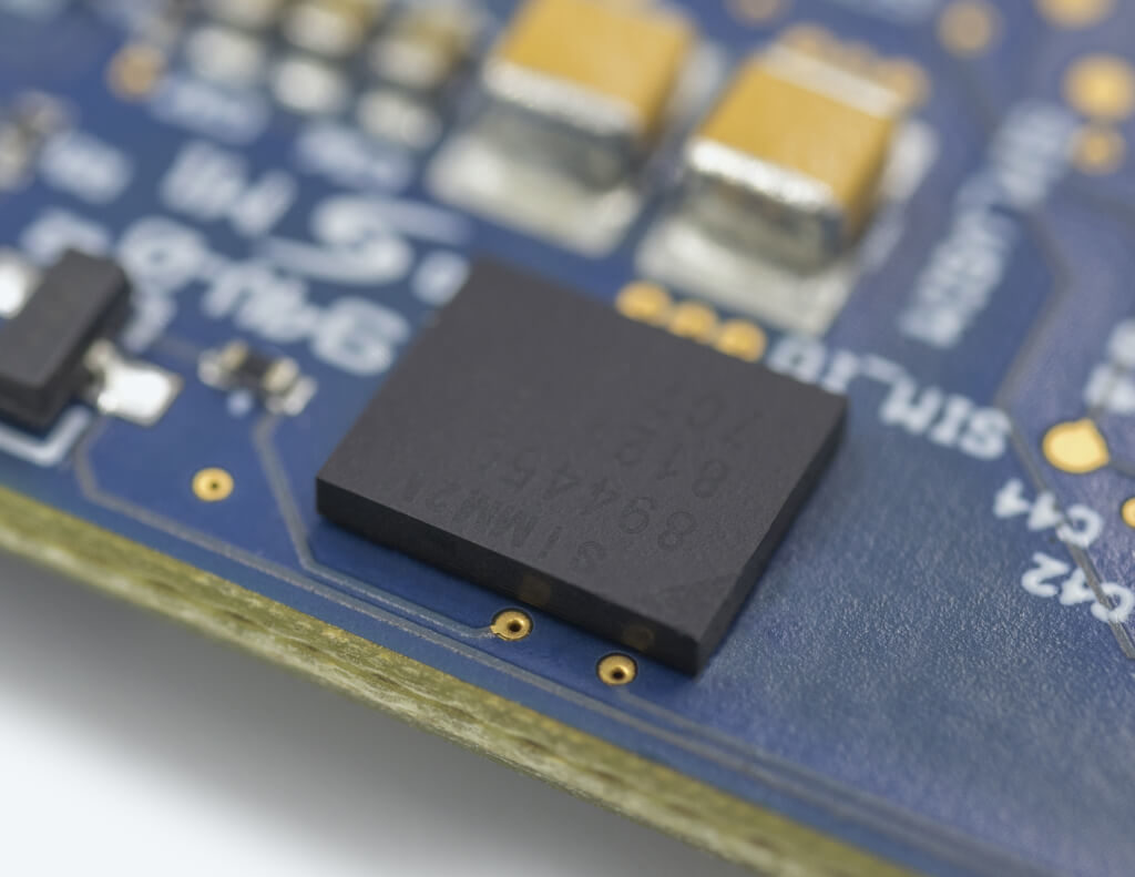 Close-up of eSIM soldered to a circuit board