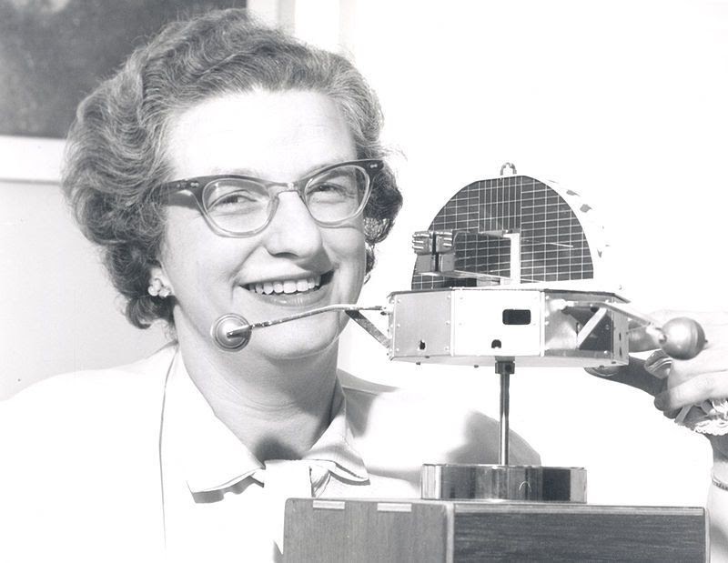 Nancy Roman with a model of the Orbiting Solar Observatory