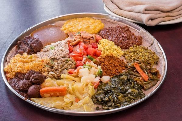<strong>Deluxe Special Veggie : </strong>Spicy splint lentil, yellow peas, greens, cabbage, shiro, salad, and potato in spic
