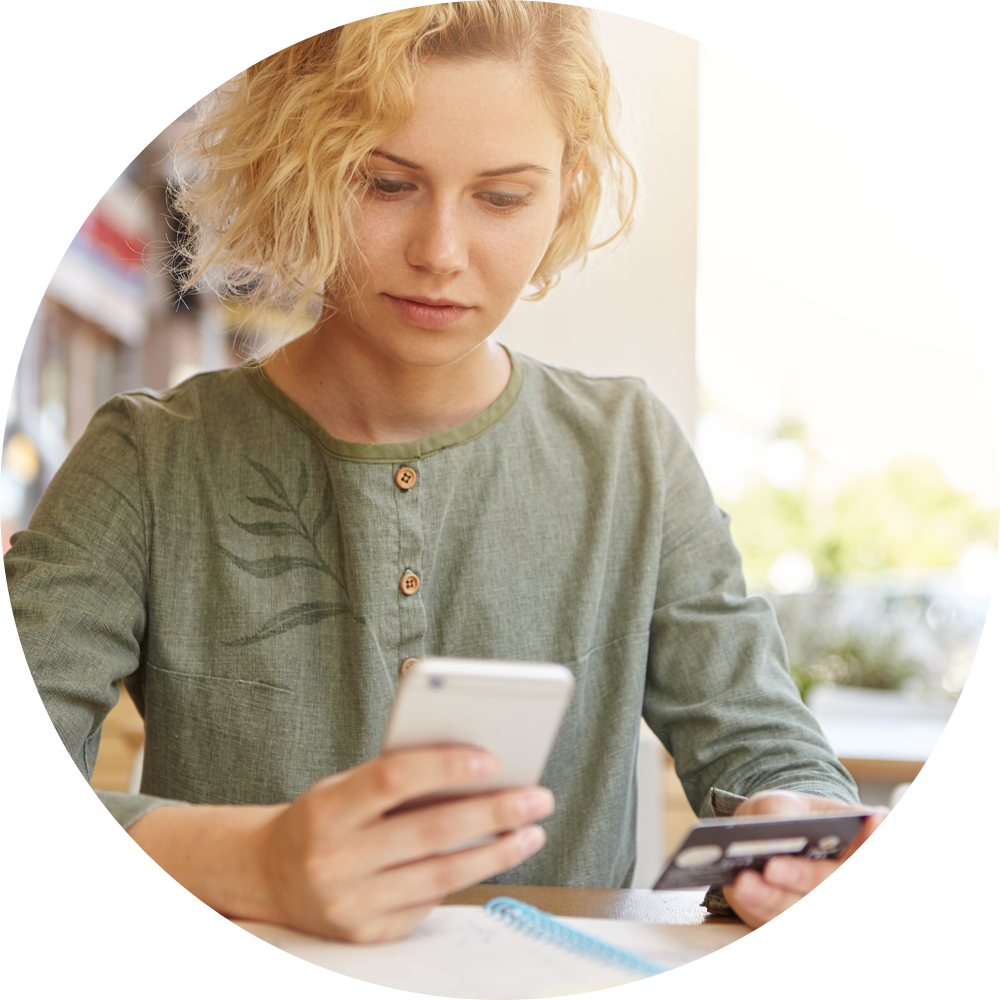 Woman paying on mobile using credit card