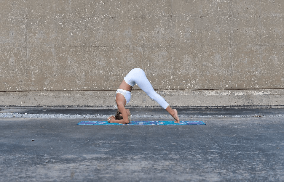The second step of doing a headstand.