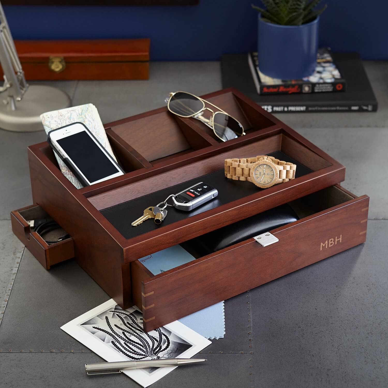 A wooden organizer and accessory charger.