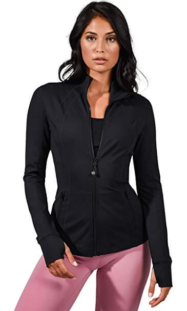A woman wearing the 90 Degree Lightweight Running Jacket.
