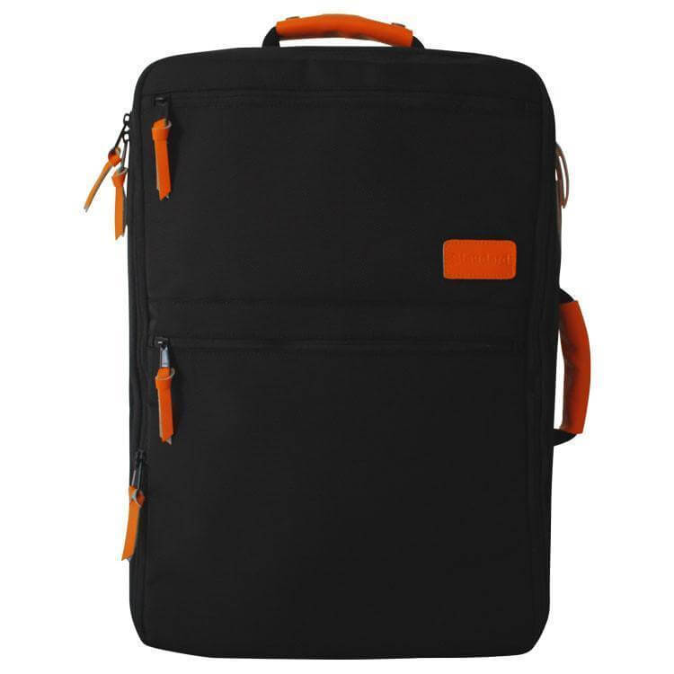 The orange and black Standard Luggage Co. travel bag.