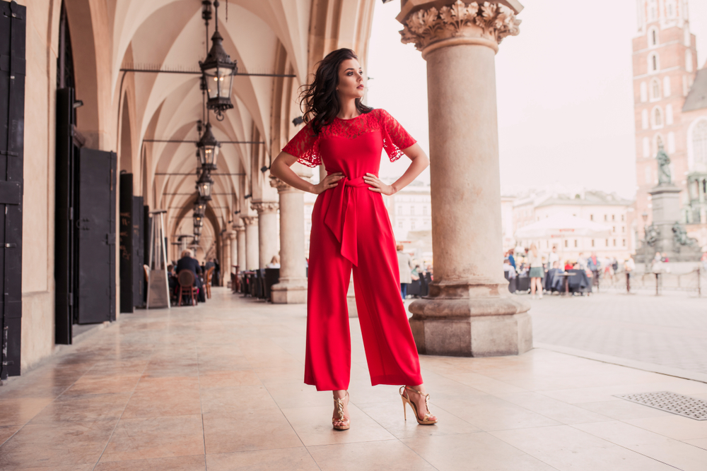 A woman in a red jumpsuit.