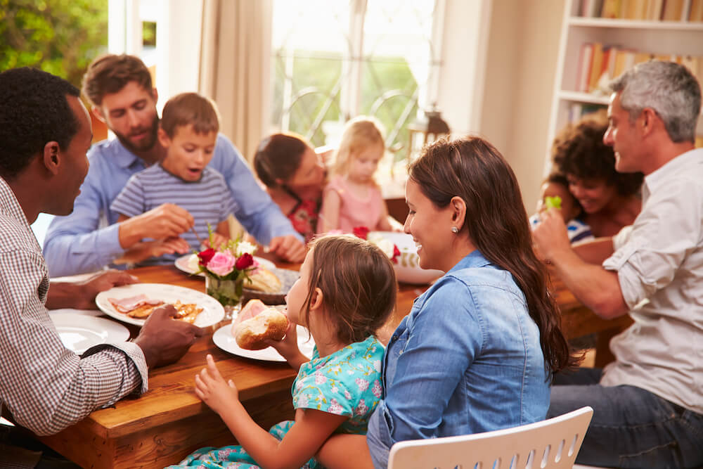 Two families sharing a meal.