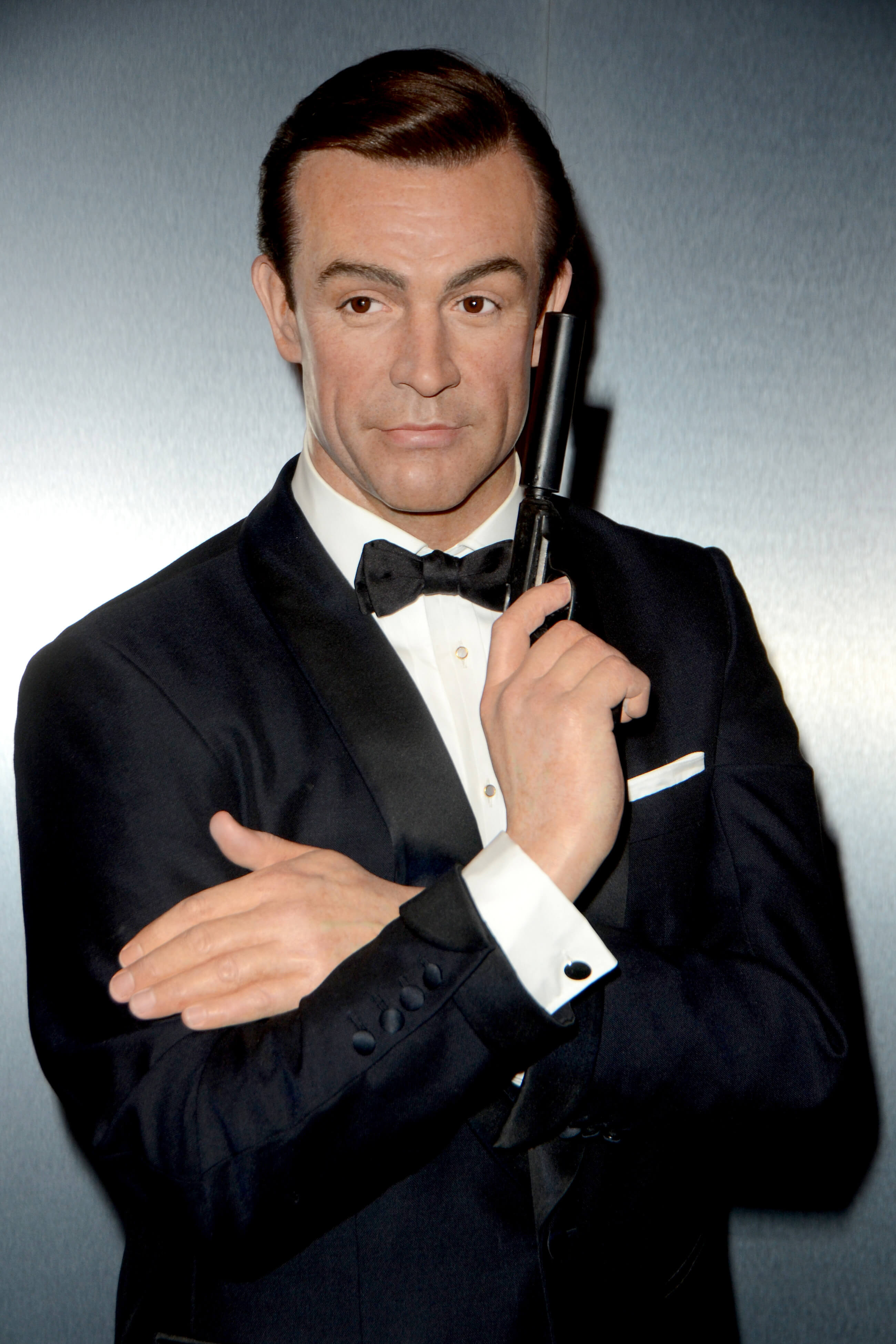 Sean Connery posing with a gun as James Bond in Dr. No 1962