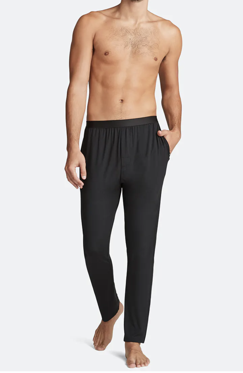A man wearing long lounge pants from MeUndies.