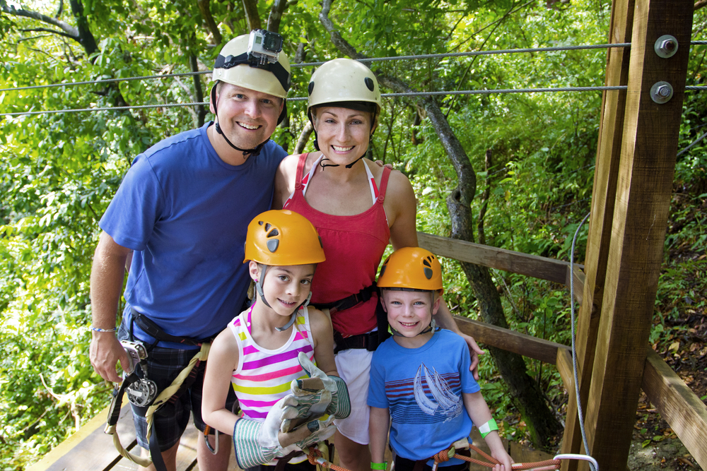 A family zip lining on a port day.