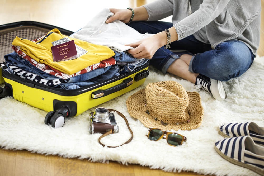 woman packing carry on bag