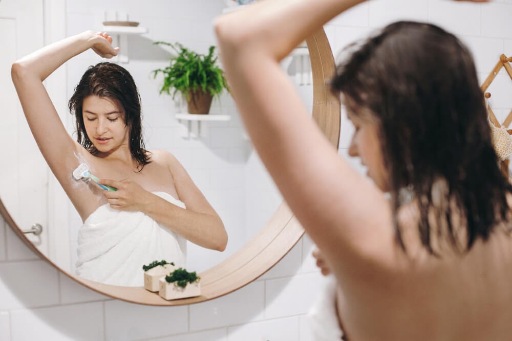 women shaving armpit
