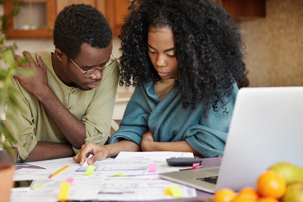 Man and woman doing paperwork together.