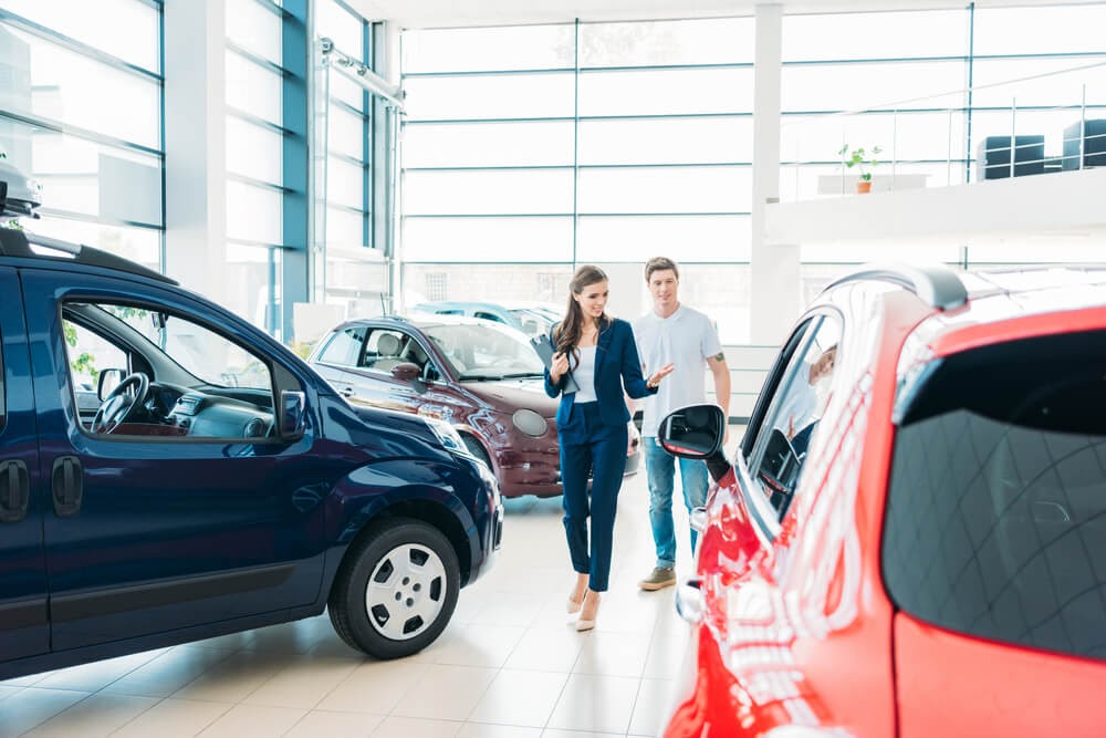 saleswomen at car dealership