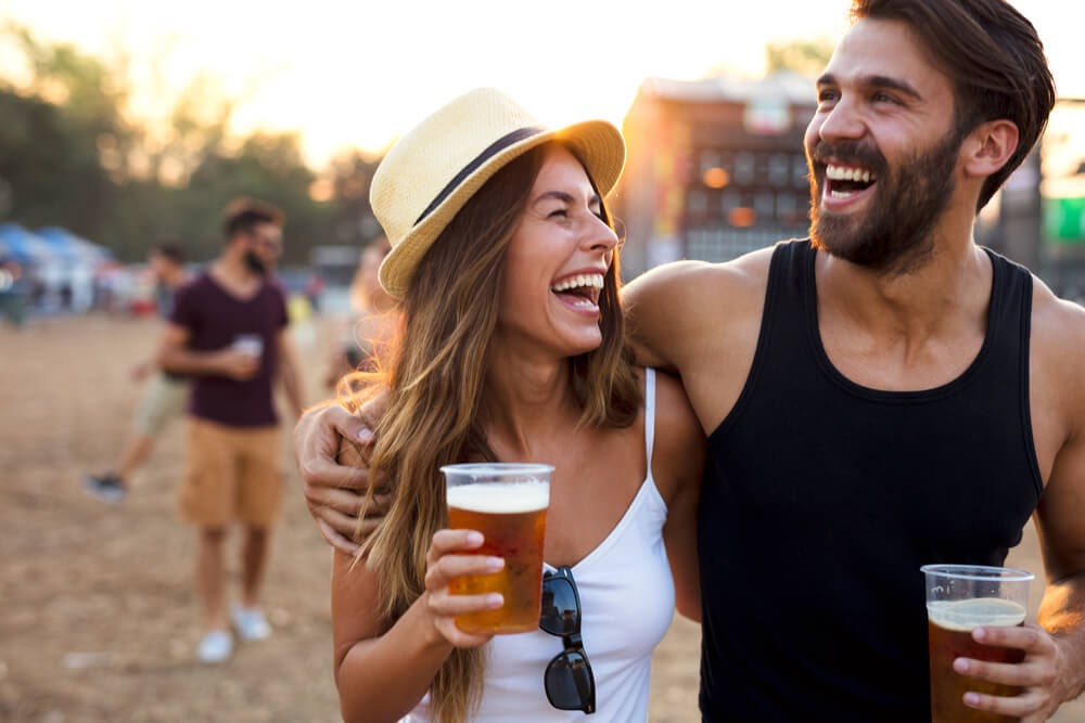 couple laughing with beer
