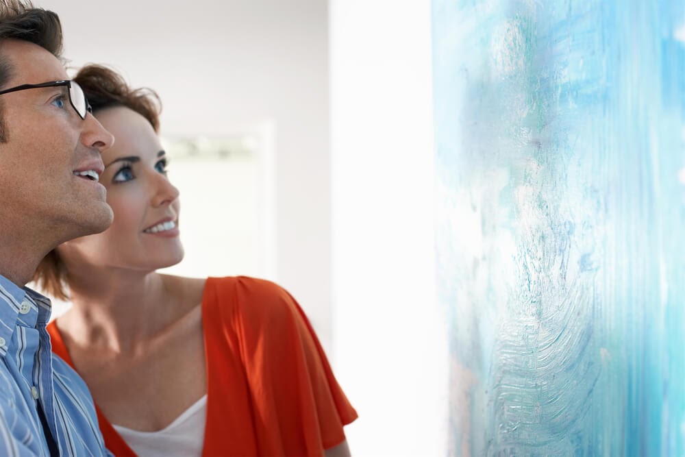 Couple looking at art in gallery