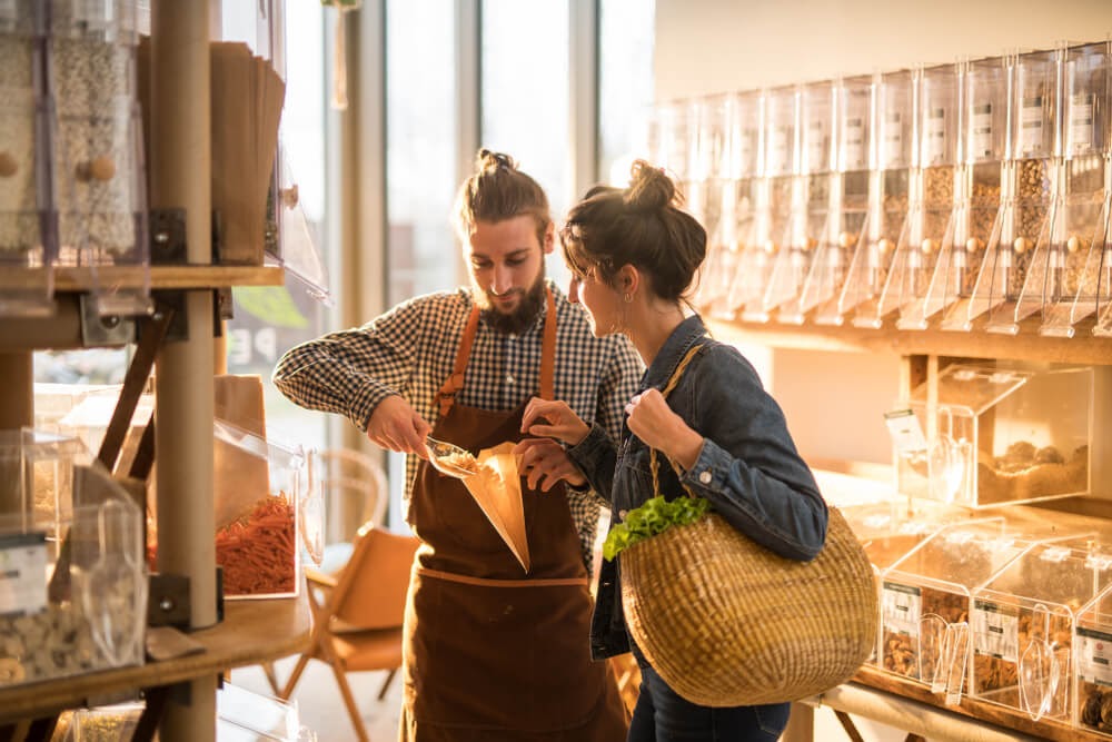 women shopping for bulk food items