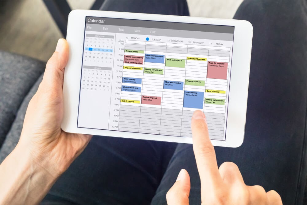 handheld tablet displaying calendar application