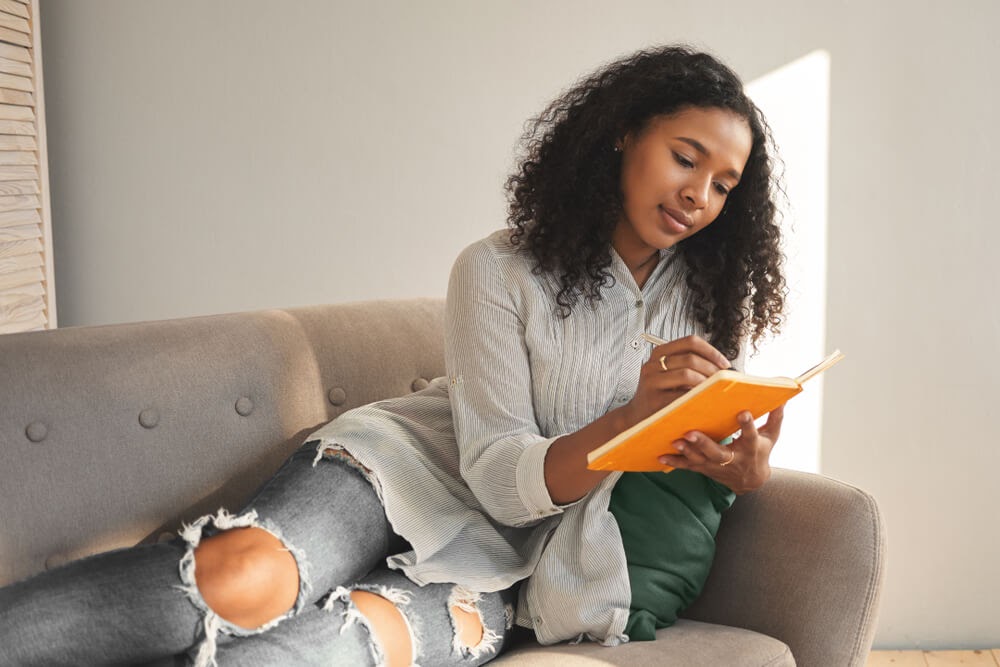 woman writing in journal